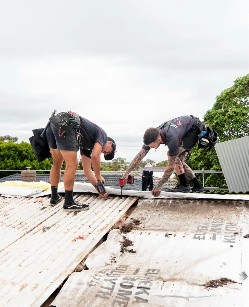 The BM Roof Plumbing crew stripping an old roof in Melbourne